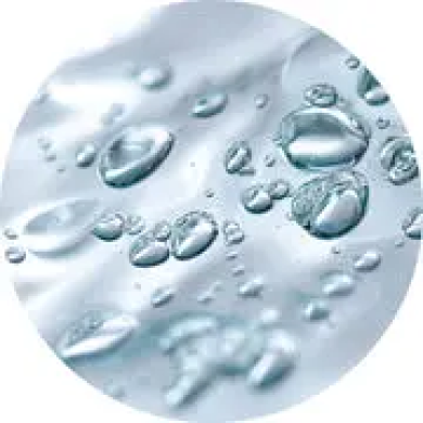 Close-up of water droplets on a smooth, reflective surface.