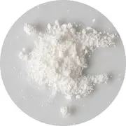 A small pile of white powder on a white surface.