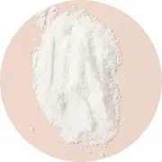 A pile of white powder on a beige background.