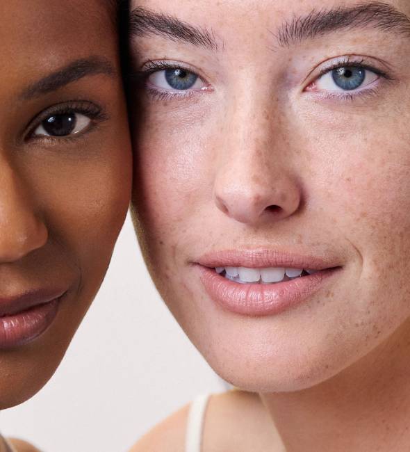 Two women's faces close up.